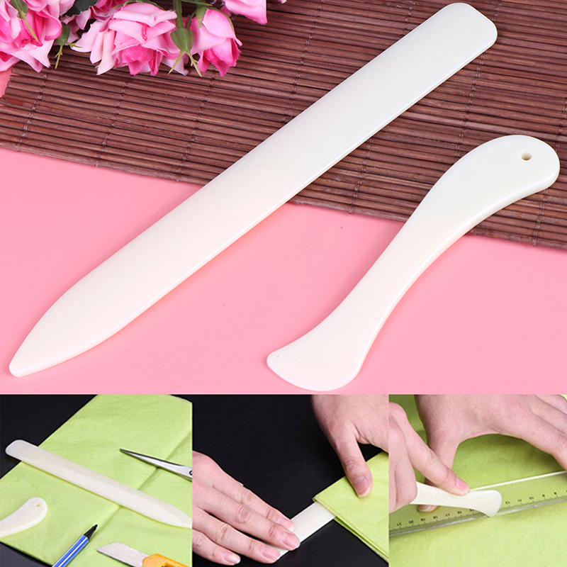 【F】قطعتان من أدوات فتح المغلفا - مراجعة Bone Folder Tool وسعره